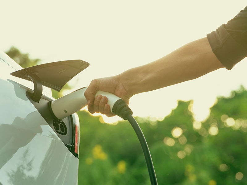 Electric vehicle being charged